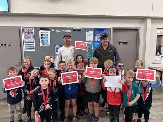 Dookie United volunteers and coaches with Auskick players at presentation night