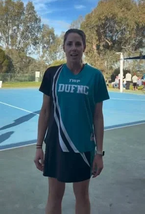 Dookie United senior netball player in club uniform on court